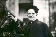 A black-and-white photo of Msgr. Nelson Baker wearing a biretta.