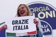 Giorgia Meloni, leader of Brothers of Italy, holds a sign at the party's election night headquarters in Rome Sept. 26, 2022. Italian voters handed a victory to a coalition of center-right parties and set the stage for Meloni to become the next prime minister. (CNS photo/Guglielmo Mangiapane, Reuters)