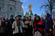 People in traditional clothes singing carols at St. Sophia Cathedral in Kyiv, Ukraine, Dec 25, 2021. (iStock)