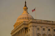 The American flag flies over the House side of the U.S. Capitol on Jan. 4, 2023. (AP Photo/Andrew Harnik)