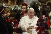 Pope Francis greets children not yet corrupted by Economics 101 classes on Christmas Eve in St. Peter’s Basilica on Dec. 24, 2022. (CNS photo/Paul Haring)