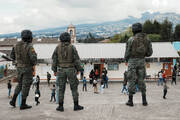 Soldiers guard a polling station during the presidential election in Ayora, Ecuador, Sunday, Aug. 20, 2023. The election was called after President Guillermo Lasso dissolved the National Assembly by decree in May to avoid being impeached. (AP Photo/Dolores Ochoa)