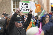 Protesters outside Leinster House, Dublin, as the Dail resumes after summer recess on Sept. 20. (Press Association via AP Images)