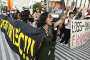 Activists demonstrate for climate justice and a ceasefire at the COP28 U.N. Climate Summit, Dec. 9, 2023, in Dubai, United Arab Emirates. (AP Photo/Peter Dejong, File)