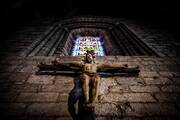 A stab crucifix hangs in an Irish church. OSV News photo/Warren Matthews