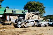 On Oct. 9, a flood damaged home along the Swannanoa River in Asheville, N.C., where residents will face a long road to recovery. Photo by Kevin Clarke.