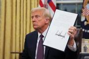 U.S. President Donald Trump signs documents in the Oval Office at the White House on Inauguration Day in Washington Jan. 20, 2025. He signed a series of executive orders including on immigration, birthright citizenship and climate. Trump also signed an executive order granting about 1,500 pardons for those charged in connection with the Jan. 6, 2021, riot at the U.S. Capitol. (OSV News photo/Carlos Barria, Reuters)