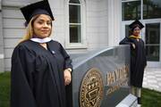Brenda and Yarely—two "Dreamers" posing for a photo before their 2018 graduation from Trinity Washington University—consider themselves symbols of the Deferred Action for Childhood Arrivals program. (CNS photo/Chaz Muth)