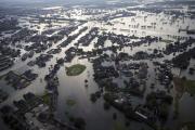 Floodwaters from Tropical Storm Harvey surround homes in Port Arthur, Texas, on Aug. 31. (AP Photo/Gerald Herbert)