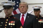 President Donald Trump stands behind and in front of members of a Marine honor guard as he greets Canadian Prime Minister Justin Trudeau and Sophie Gregoire Trudeau as they arrive at the White House on Oct. 11. (AP Photo/Carolyn Kaster)
