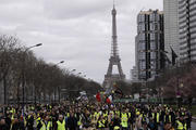 Yellow Vest Protesters march near the Eiffel Tower in Paris on March 2. (AP Photo/Kamil Zihnioglu)