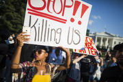 People demonstrate outside the White House in Washington on July 8, 2016 against the nationwide police shootings of African- Americans (CNS photo/Jim Lo Scalzo, EPA).