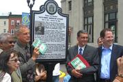 The dedication ceremony of Pietro di Donato, Plaza in Union City, New Jersey, May 22, 2010. Holding up a copy of di Donato’s novel, Christ in Concrete, is the author’s son, Richard (Wikicommons/Luigi Novi).