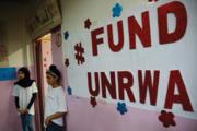 Palestinian refugee students stand outside a classroom in Beirut, Lebanon, on Sept. 3. (AP Photo/Hussein Malla)