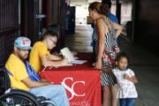 Students tend to family in need at Universidad Sagrado Corazón in San Juan, Puerto Rico. (Photo: J.D. Long-García)