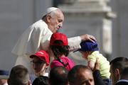 Pope Francis greets children during his general audience in St. Peter's Square at the Vatican, June 8 (CNS photo/Paul Haring). 