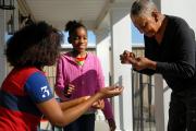 GENERATIONAL SOLIDARITY. Children spend time with their grandmother in 2012 on the front porch of their home in Hillsdale, Mo.