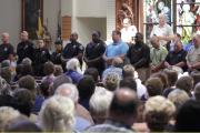 Police officers attend a July 17 vigil at St. John the Baptist Church in Zachary, La., for the fatal attack on policemen in Baton Rouge, La. (CNS photo/Jeffrey Dubinsky, Reuters)