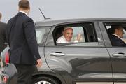 Pope Francis waves as he rides away in a Fiat after a short arrival ceremony on the airfield at Joint Base Andrews outside Washington Sept. 22, 2015. (CNS photo/Jonathan Ernst, Reuters)