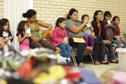 THE HEART OF TEXAS. Migrants sit at the Sacred Heart Catholic Church temporary shelter in McAllen, Tex. 