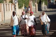 Women walk along a street Feb. 20, 2016, in Asmara, Eritrea. The nation's bishops said that because of years of war and unrest, "young people, mothers, children and families have become victims of exile and of destabilization." (CNS photo/Thomas Mukoya, Reuters)