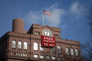 Students hung a banner from the Cooper Union Foundation Building during a December 2012 occupation.” (Wikicommons)