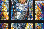 Stained-glass window depicting Christ rising over the city of Houston