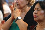 MAKING ALL WELCOME. A woman prays during a Spanish-language Mass at St. John-Visitation Church in the Bronx, N.Y., on Sept. 13. 
