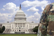 The most trusted institution in the United States, keeping watch in front of the least trusted institution. (iStock/inhauscreative)