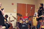 Austin Rose on drums with his band, Interfaith Rock