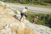 CLIFFHANGER. The author, right, rappelling Australian style near Wyoming Catholic College.