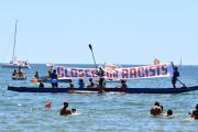 People join a demonstration titled, "City Flotilla, at Sea Against Racism," to protest against the scheduled arrival of the C Star, a ship that an anti-immigrant group has chartered to try and halt migrant arrivals to Europe from Africa and elsewhere, in Catania, Sicily Island, Italy, on July 29. (Orietta Scardino/ANSA via AP)