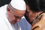 LENDING AN EAR. Pope Francis listens to a woman while greeting the disabled during his general audience in St. Peter’s Square at the Vatican on March 11.