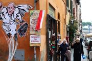 “Superpope” graffiti has sprouted up on buildings around Vatican City. (Alessandro Bianchi/Reuters)