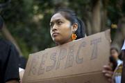 Woman in San Diego at a vigil and rally last year to show support for undocumented Central American minors flooding across the U.S.-Mexico border.