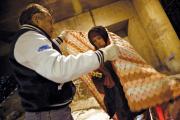  Dr. Patrick Angelo wraps a homeless man in blankets under the overpasses on Lower Wacker Drive in Chicago, ill.