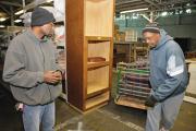 SUCCESS STORY. Michael Gordon, left, has become a manager for a furniture bank run by Caritas, an agency providing services to homeless people in Richmond, Va. (CNS photo/Jay Paul)