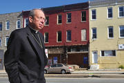 HOPE BUILDING. Archbishop William Lori tours West Baltimore the morning after civil unrest brought national attention to conditions in the city’s Sandtown neighborhood.