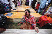 Mourning in Pakistan: A Christian woman mourns her brother, killed along with 80 others in an attack at All Saints Church in Peshawar, Pakistan, in 2013.