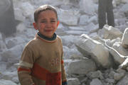 WAR CRIME. A boy of Aleppo weeps amid the rubble of a building bombed by Syrian government forces on March 6.