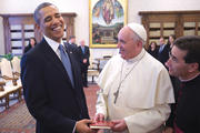 LIGHT READING. U.S. President Barack Obama shares a laugh with Pope Francis as he receives a copy of the pope’s apostolic exhortation, “Evangelii Gaudium.”