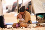 SAFE AT LAST. A woman who fled the violence in the Iraqi town of Sinjar at a camp in Syria’s northern town of Qamishli.