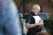 PEACEMAKING. Father Robert Rosebrough of Blessed Teresa of Calcutta Parish in Ferguson, Mo., leads a prayer vigil for peace on Aug. 11.