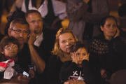 EYES ON THE PRIZE. Outside the Arizona Capitol in Phoenix, Abel and Idalia Rodríguez watch a live broadcast as President Obama describes his plan for immigration reform on Nov. 20.