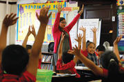 MAKING THE GRADE. Maria Rodriguez with her third-grade students at Maternity of the Blessed Virgin Mary School in Chicago