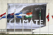 CLIMATE CHECK. A banner waving from the U.N. General Assembly building in New York on June 30 defines the nature of the debate inside.