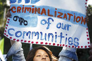 DETENTION PROTEST. An immigration advocate demonstrates in Los Angeles on July 10. 
