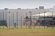 Children play in a playgound area outside the T. Don Hutto Family Residential Facility in Taylor, Texas in June 2009.