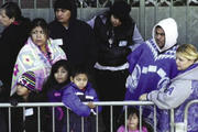 Redistributing Wealth?Families wait in line for the Los Angeles Mission's Christmas meal service. 