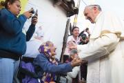 HUMANE TOUCH. Pope Francis with people of Banado Norte, a poor neighborhood in Asuncion, Paraguay, July 12. 